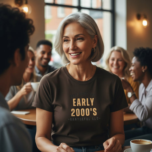 Woman wearing a t-shirt with 'Early 2000's' text in a casual setting with friends.